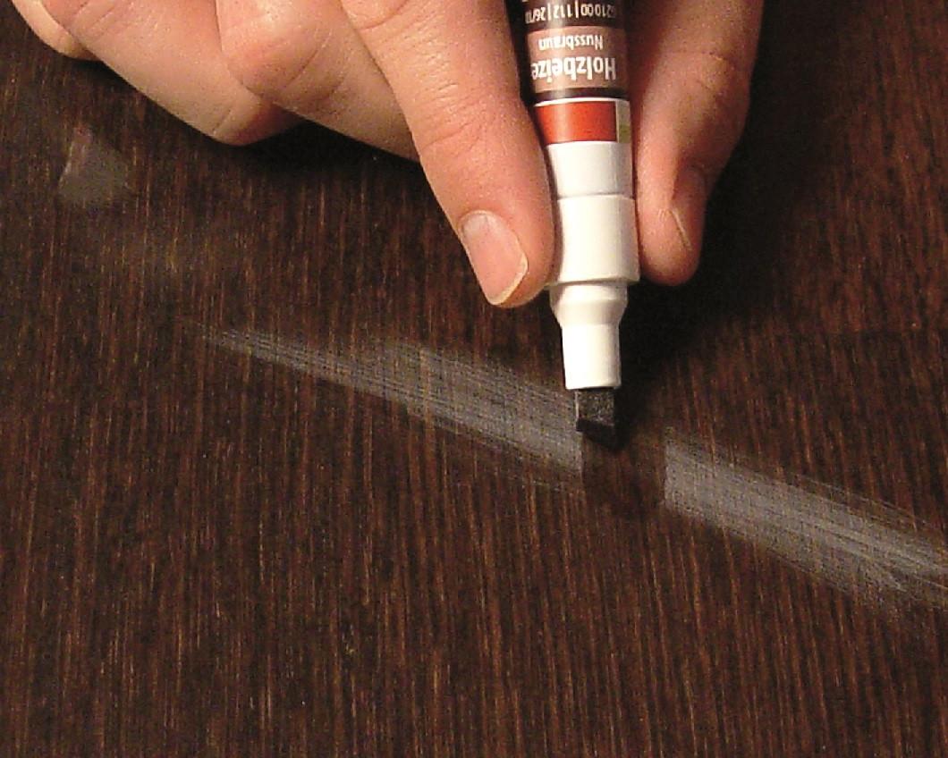 One easy way to get rid of sanding scratches in wood flooring with Felt Touch-Up Pens!